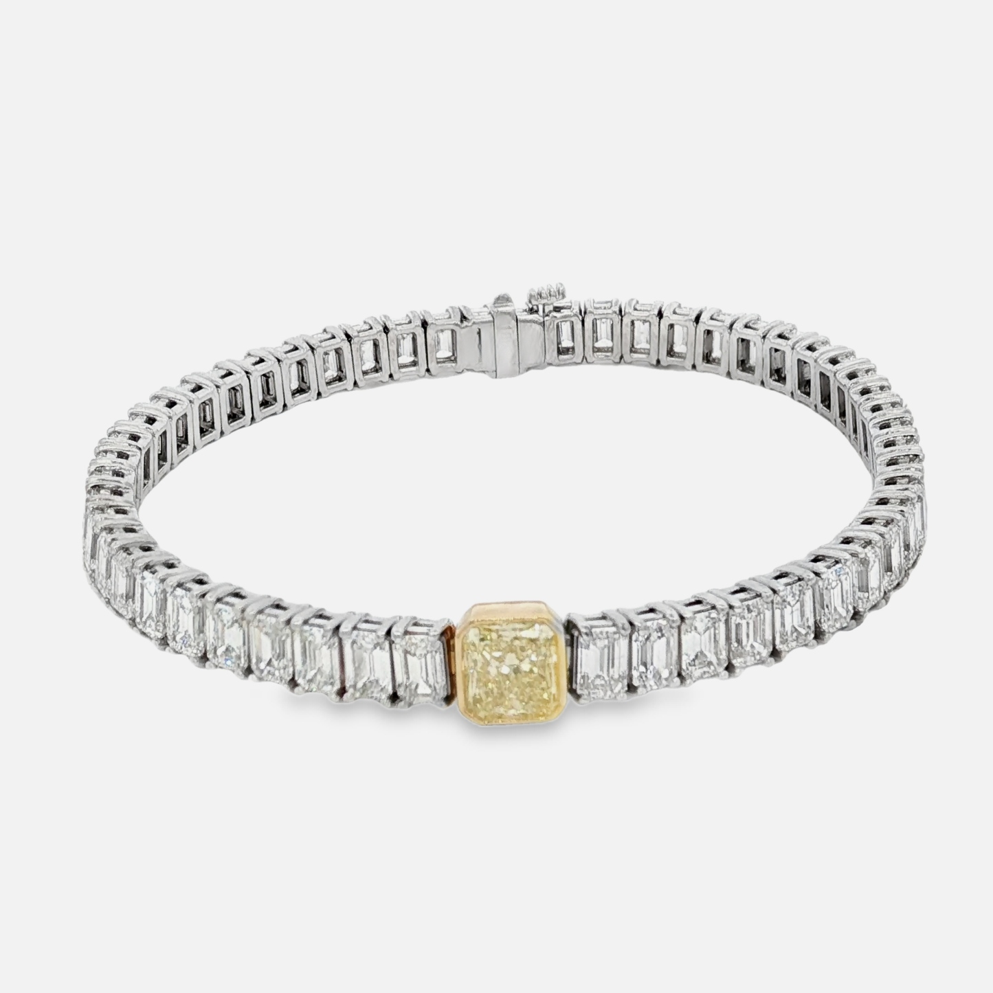 18k-white-gold-tennis-bracelet-with-51-ec-stones-13-42-ct-and-1-00ct-fancy-intense-yellow-radiant-cut-diamond