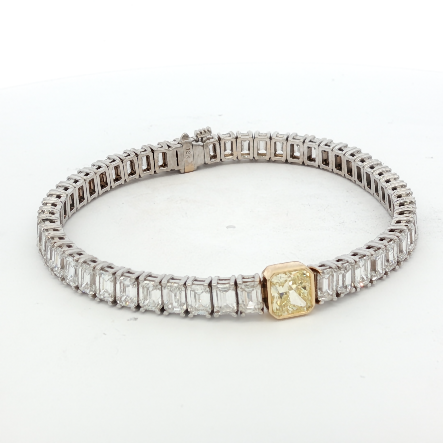 18K White Gold Tennis Bracelet with 51 EC stones (13.42 ct) and 1.00ct Fancy Intense Yellow Radiant Cut Diamond