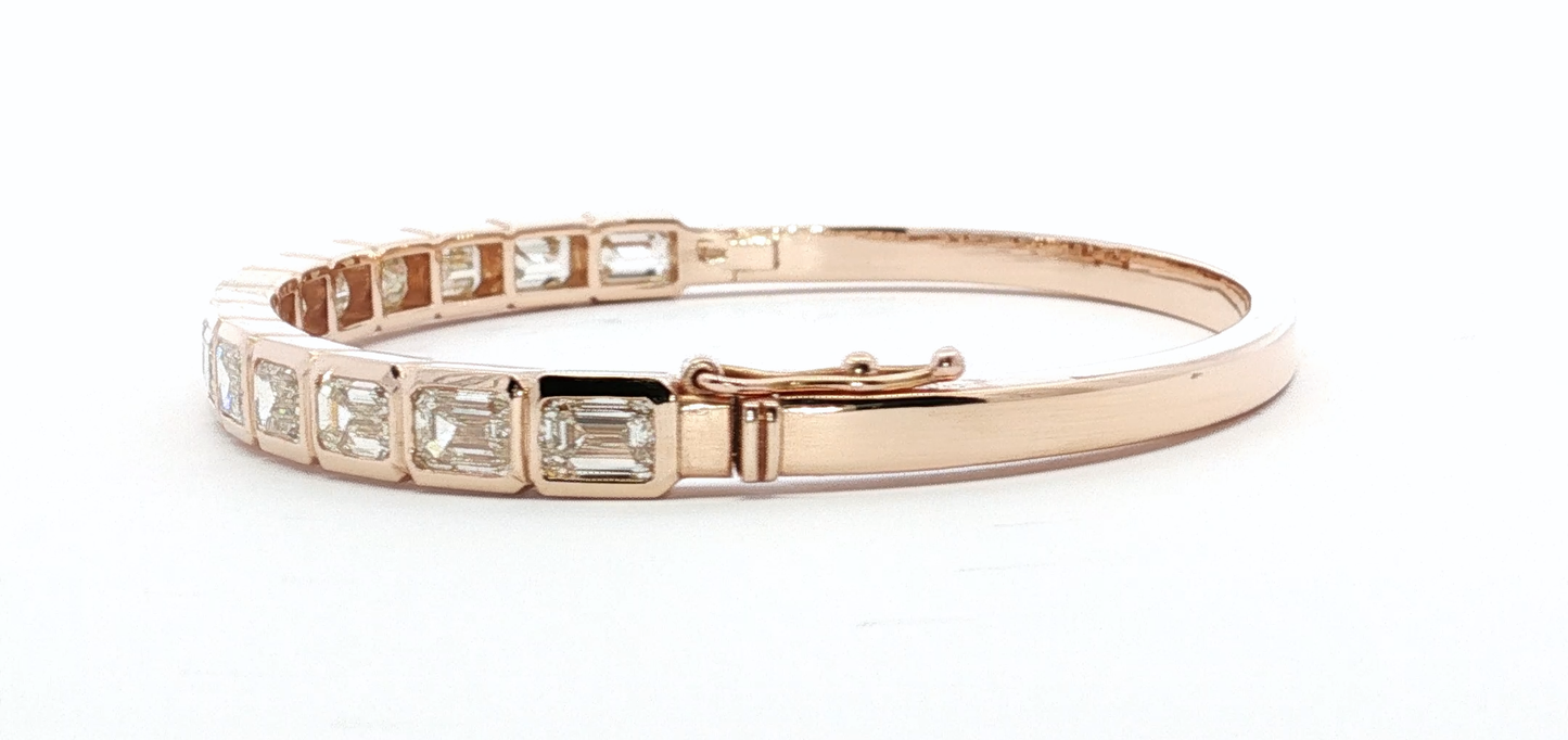 14kt-rose-gold-bangle-with-7ct-emerald-cut-diamonds