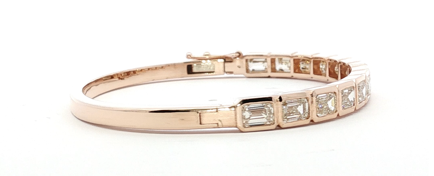 14kt-rose-gold-bangle-with-7ct-emerald-cut-diamonds