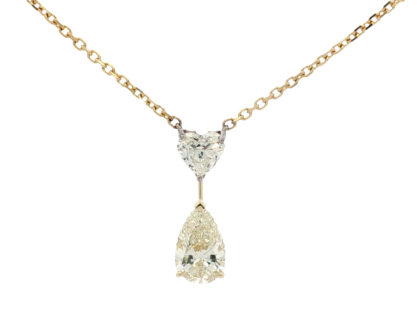 yellow-gold-necklace-with-heart-shape-and-pear-cut-diamond-pendant