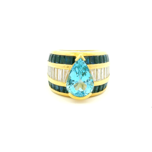 18kt yellow Gold Cocktail Ring with Pear-Shaped Aquamarine, sapphire and baguettes.