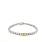 white-gold-tennis-bracelet-with-round-brilliant-diamonds-and-a-fancy-yellow-oval