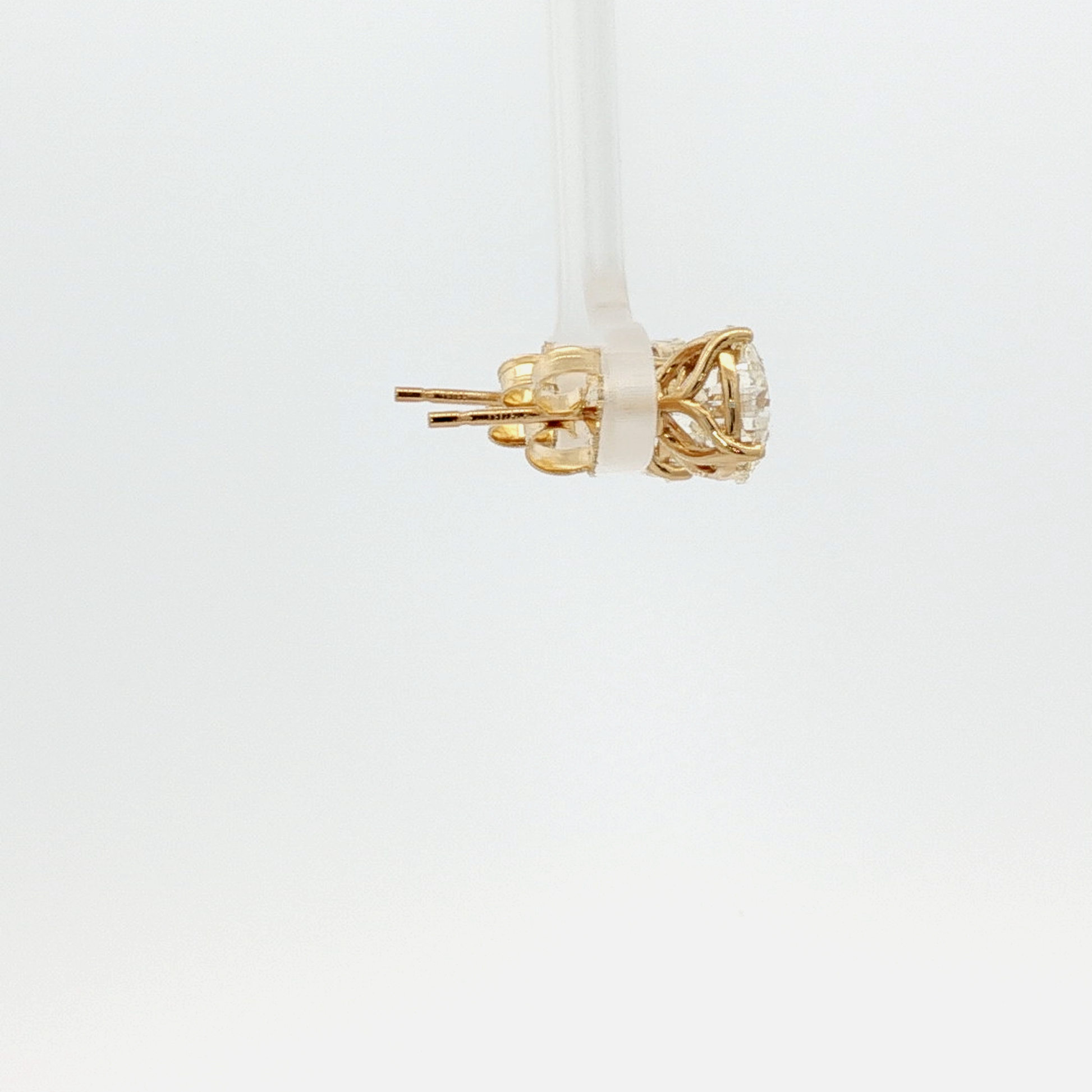 a-matching-pair-of-l-if-2-24-and-2-17-brilliant-cut-diamond-stud-earrings-in-yellow-gold