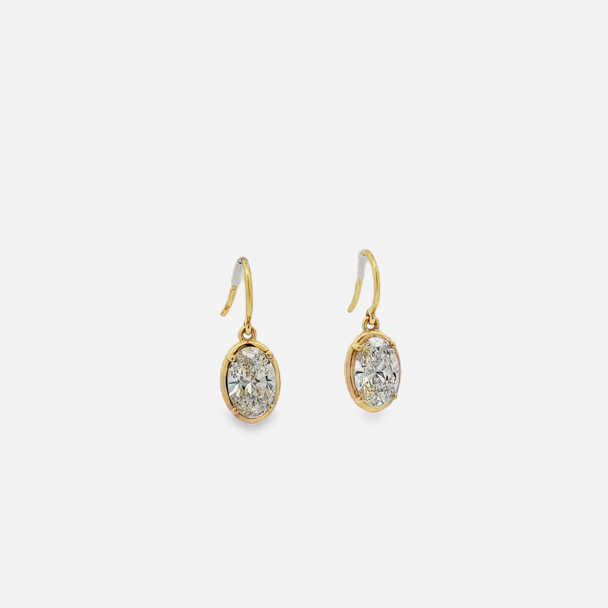 18K Yellow Gold Drop Earrings with a matching pair of K si1 Oval Brilliant Cut Diamonds