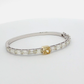 14k-white-gold-bangle-featuring-a-1-53-fancy-intense-yellow-gia-yellow-radiant-cut-diamond