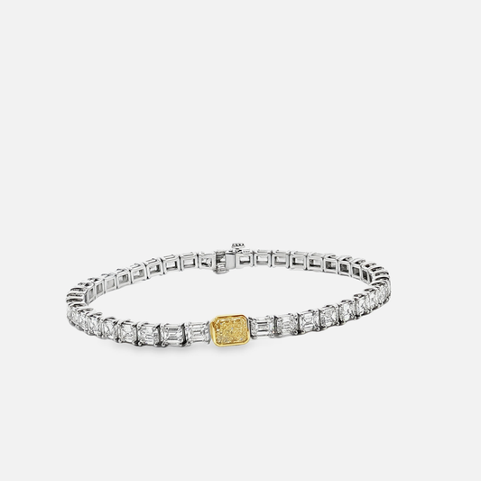 18K White Gold Tennis Bracelet with 0.790Fancy Yellow Radiant Cut Diamond and 41 emeralds