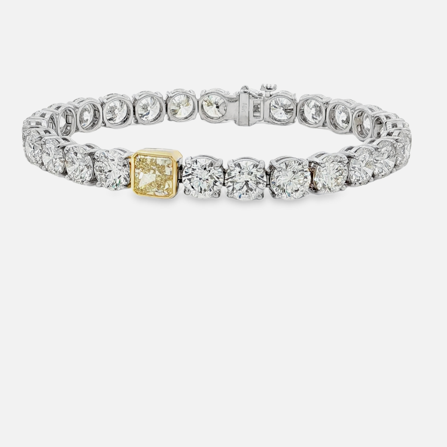 18kwg-tennis-bracelet-with-26ct-brilliant-cut-diamonds-and-a-1-72-fancy-yellow-diamond