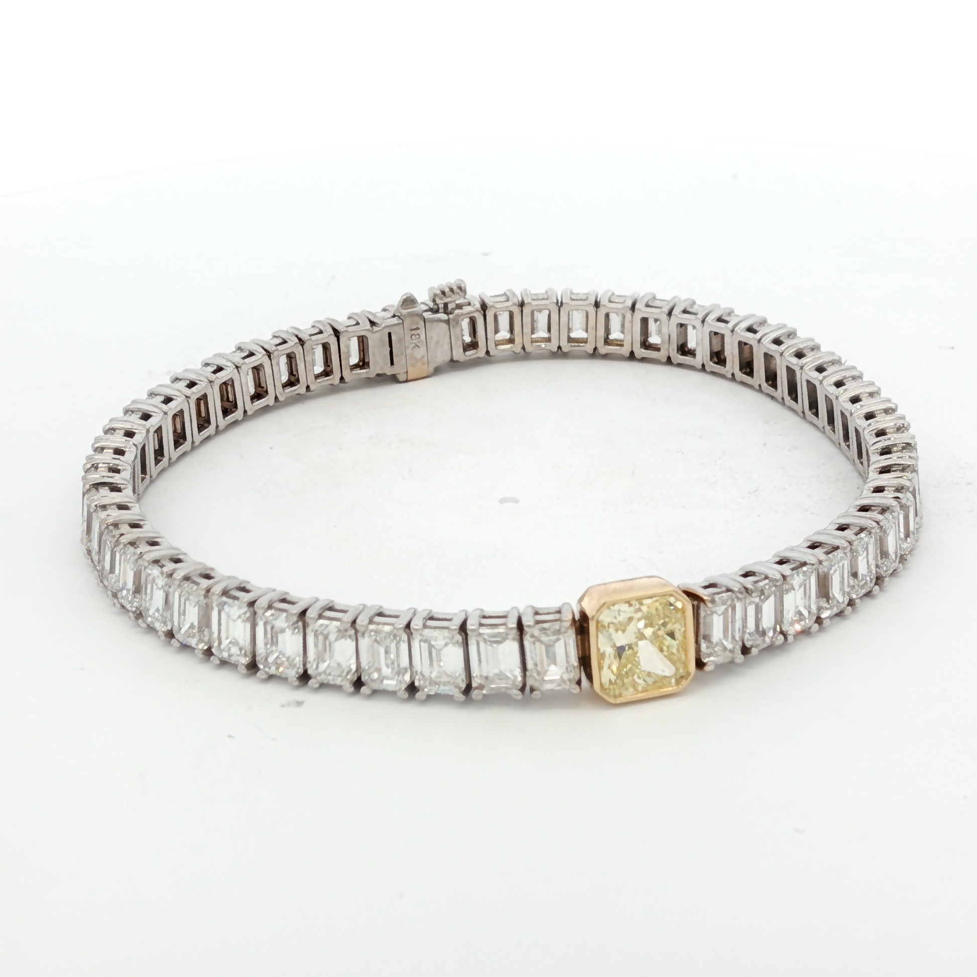 18K White Gold Tennis Bracelet with 51 EC stones (13.42 ct)  and 1.00ct Fancy Intense Yellow Radiant Cut Diamond