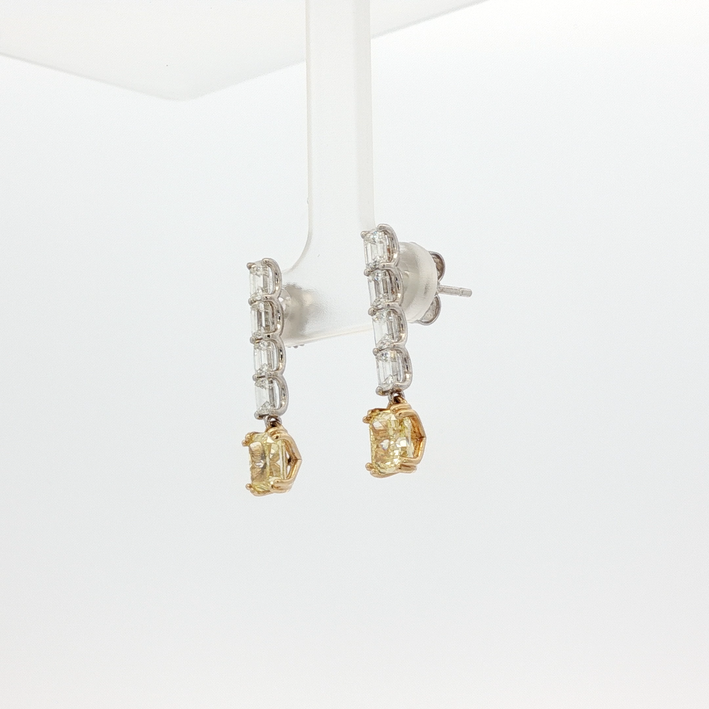 one-of-a-kind-matching-set-of-fancy-intense-yellow-cushion-cut-diamond-dangle-earrings-in-white-gold