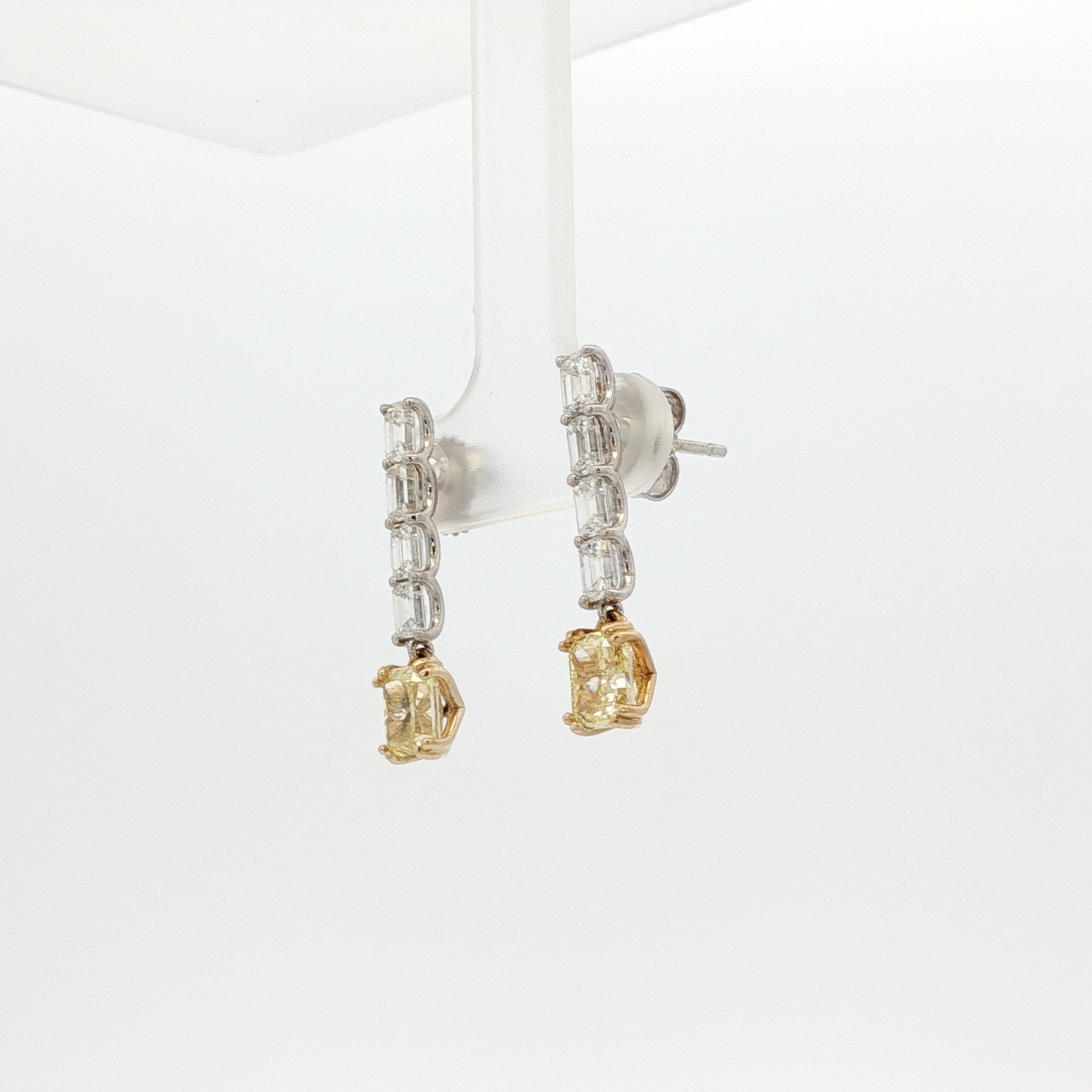 one-of-a-kind-matching-set-of-fancy-intense-yellow-cushion-cut-diamond-dangle-earrings-in-white-gold
