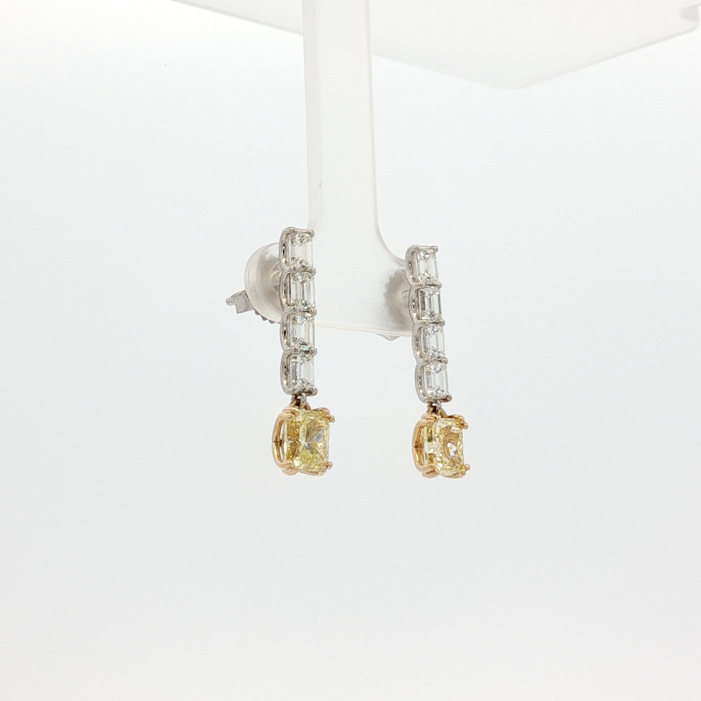 one-of-a-kind-matching-set-of-fancy-intense-yellow-cushion-cut-diamond-dangle-earrings-in-white-gold