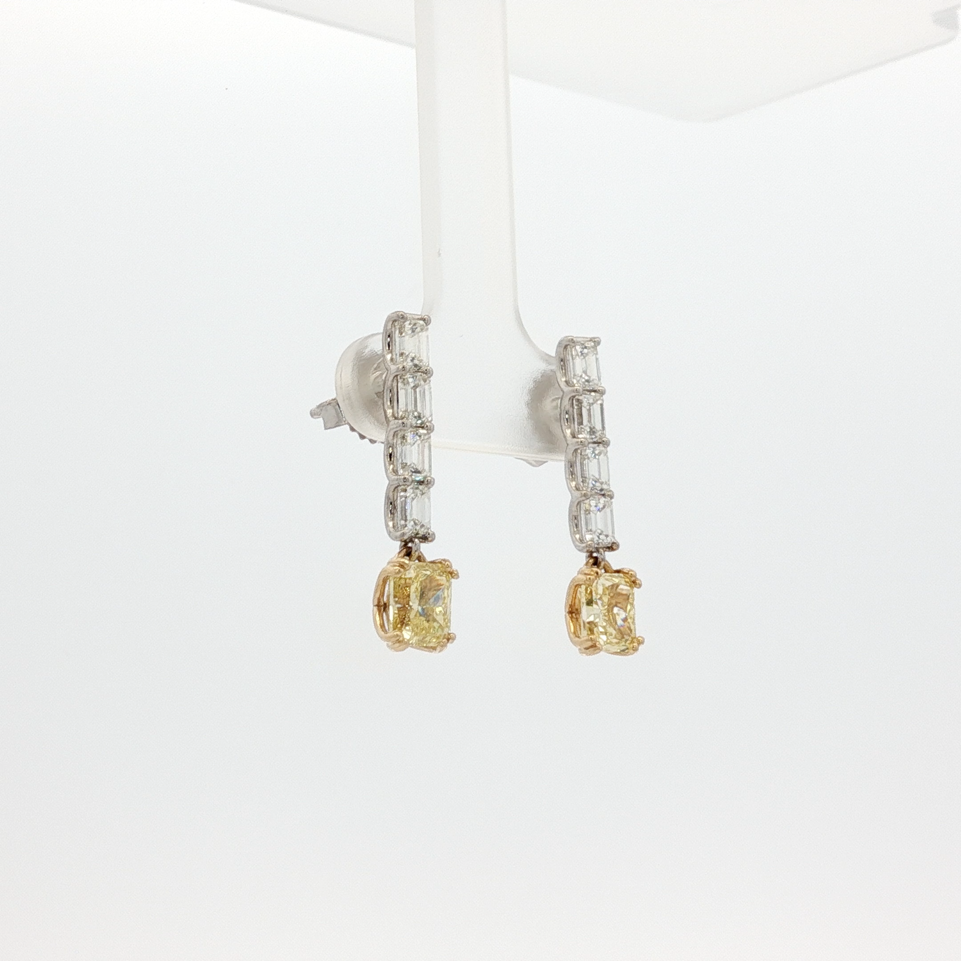 one-of-a-kind-matching-set-of-fancy-intense-yellow-cushion-cut-diamond-dangle-earrings-in-white-gold