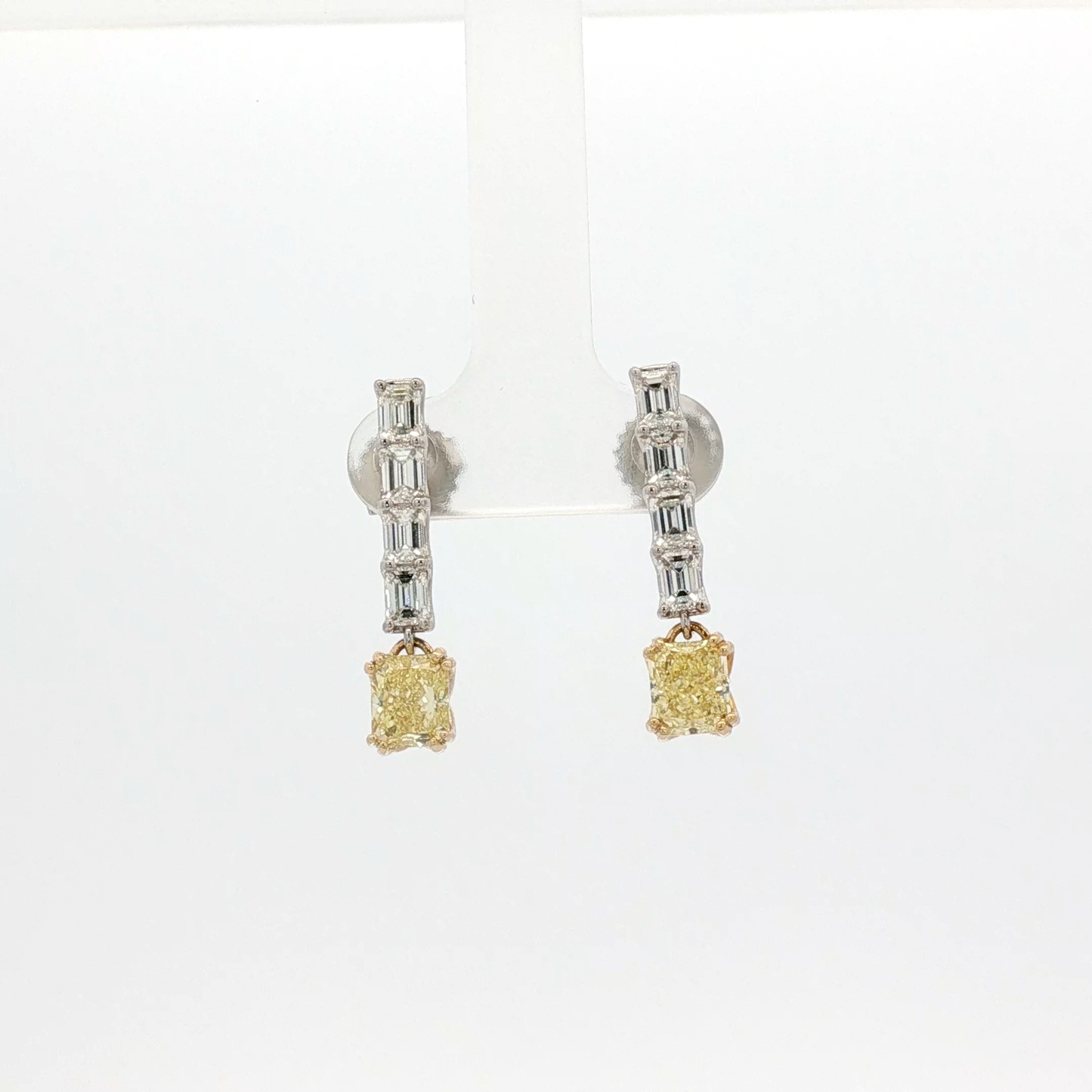 one-of-a-kind-matching-set-of-fancy-intense-yellow-cushion-cut-diamond-dangle-earrings-in-white-gold