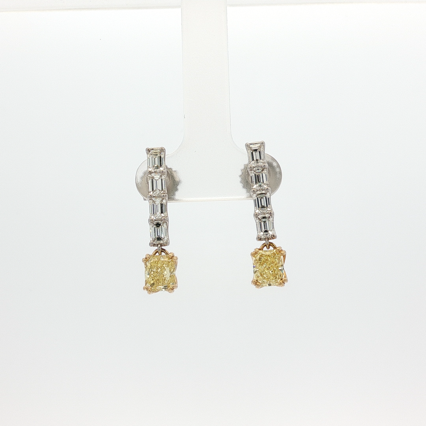 one-of-a-kind-matching-set-of-fancy-intense-yellow-cushion-cut-diamond-dangle-earrings-in-white-gold