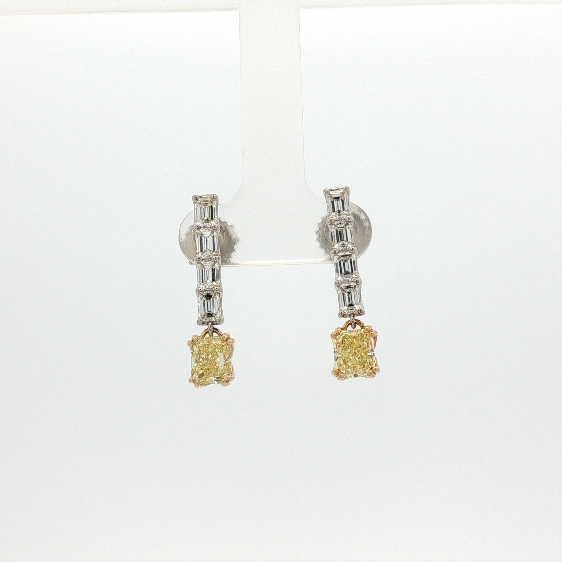 one-of-a-kind-matching-set-of-fancy-intense-yellow-cushion-cut-diamond-dangle-earrings-in-white-gold