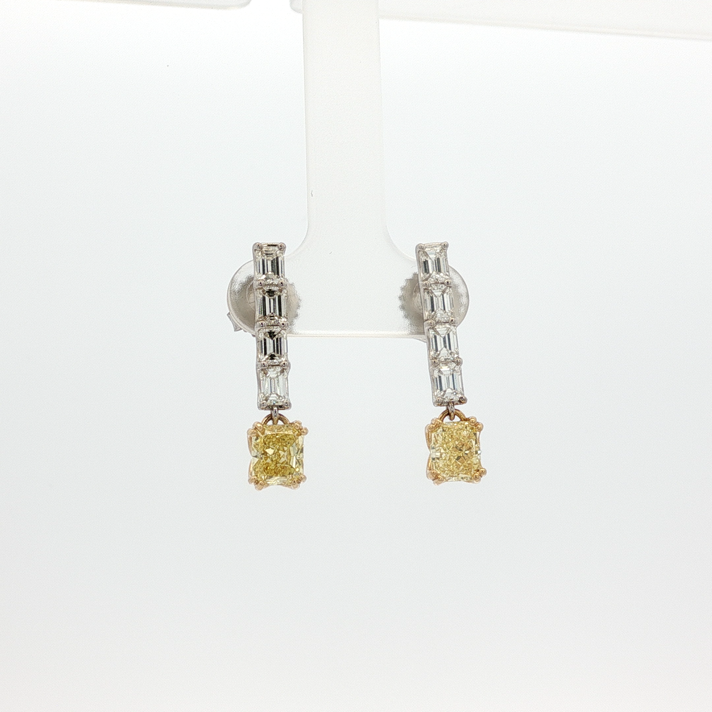 one-of-a-kind-matching-set-of-fancy-intense-yellow-cushion-cut-diamond-dangle-earrings-in-white-gold