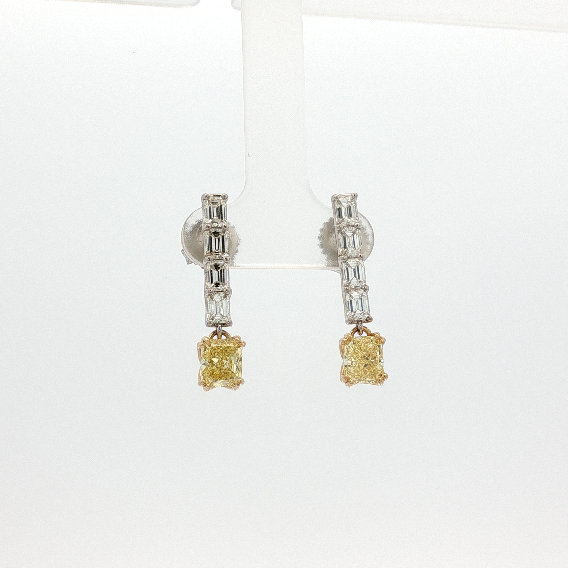 one-of-a-kind-matching-set-of-fancy-intense-yellow-cushion-cut-diamond-dangle-earrings-in-white-gold
