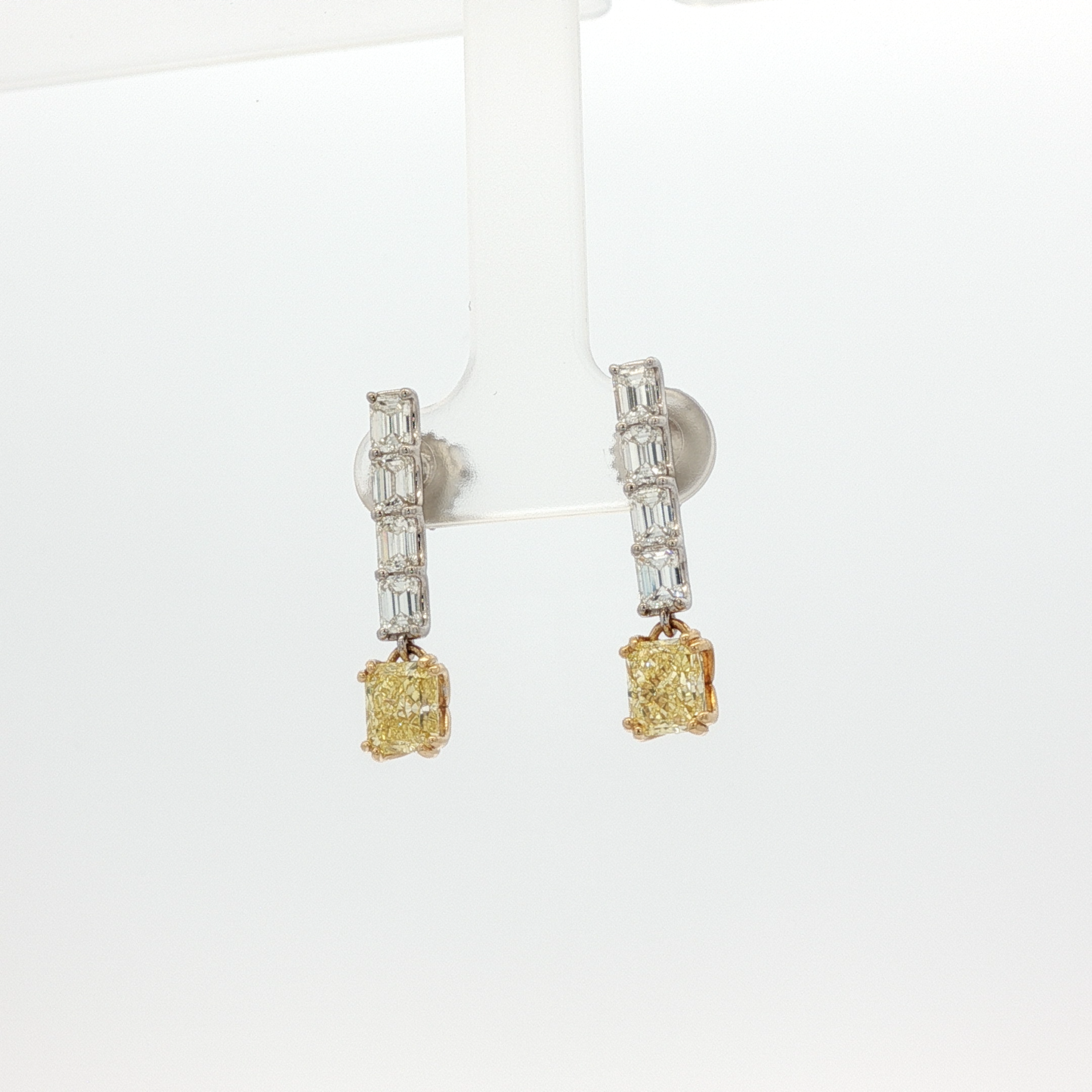 one-of-a-kind-matching-set-of-fancy-intense-yellow-cushion-cut-diamond-dangle-earrings-in-white-gold