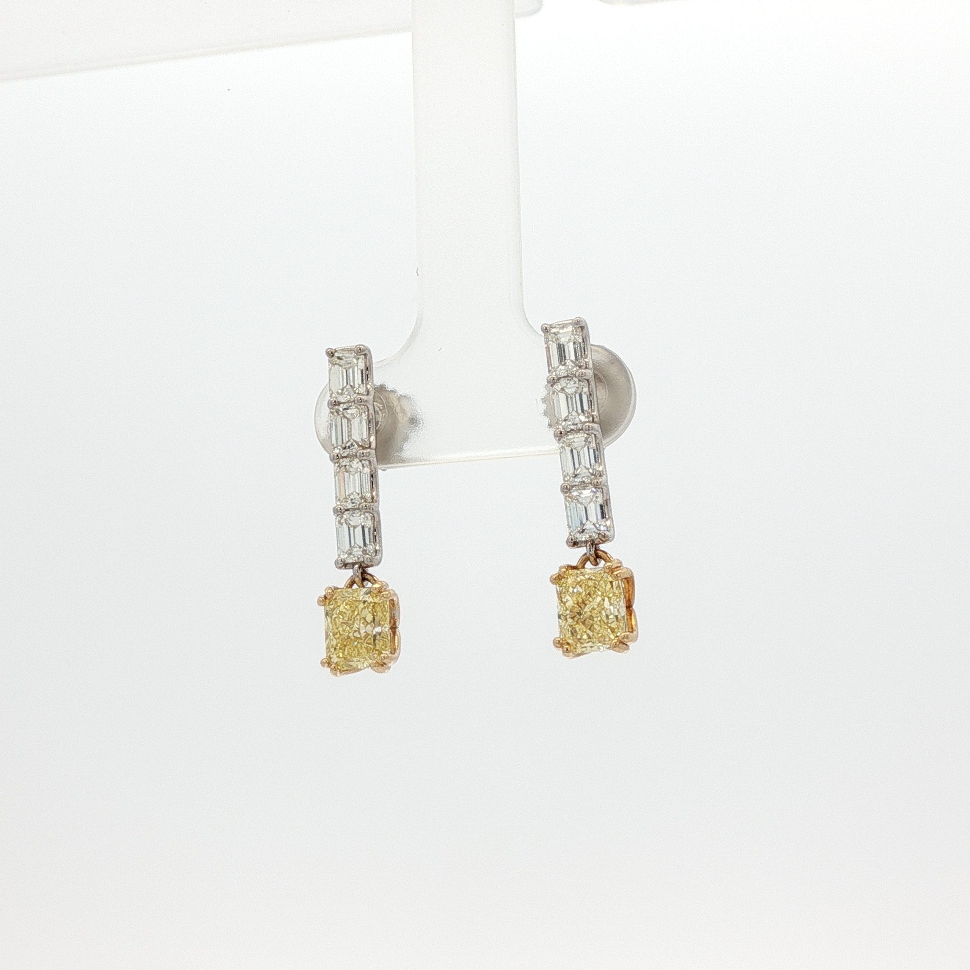 one-of-a-kind-matching-set-of-fancy-intense-yellow-cushion-cut-diamond-dangle-earrings-in-white-gold