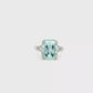 18kt White Gold Ring with Emerald-Cut Aquamarine and split shank diamond mouting.