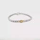 White Gold Tennis Bracelet with Round Brilliant Diamonds and a Fancy yellow Oval