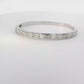 Elegant 14k White Gold Bangle with 7.760ct Emerald Cut Diamonds
