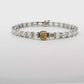 18K White Gold Tennis Bracelet with 29 Emerald Cut Diamonds and a GIA 1.50 Fancy intense Yellow Diamond