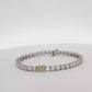 18K White Gold Tennis Bracelet with 0.790Fancy Yellow Radiant Cut Diamond and 41 emeralds